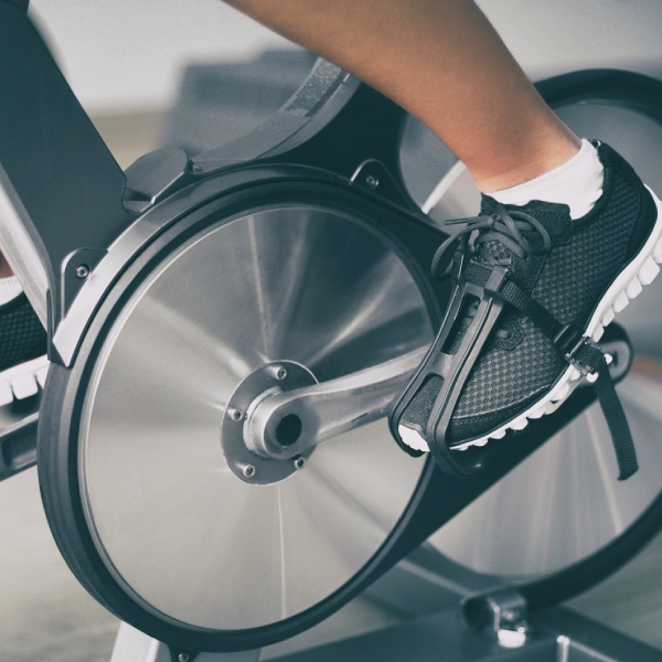 A person is riding an exercise bike in the gym.