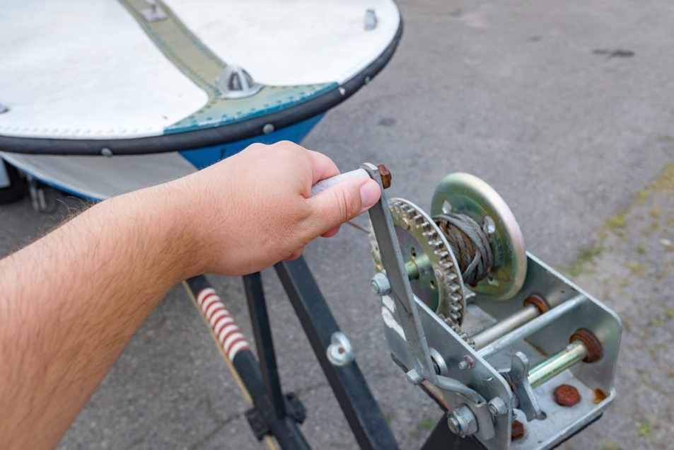 A person holding onto the handle of a device