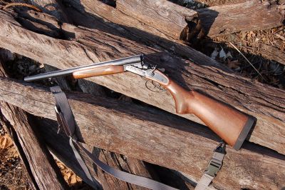A gun that is sitting on some wood