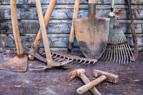 A pile of dirt with some tools on it