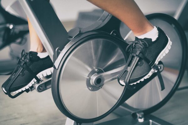 A person is riding an exercise bike in the gym.